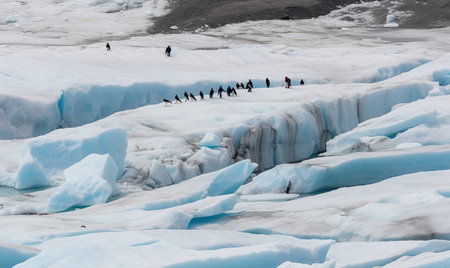 The penguins huddle together on the icy iceberg Creating using generative AI toolsの素材