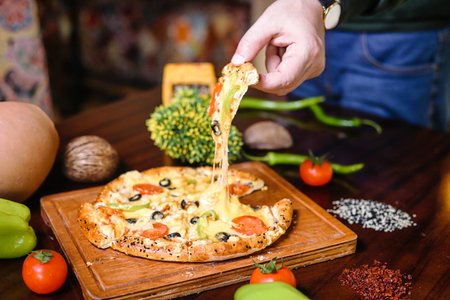 A plate filled with a delicious assortment of food is displayed on a sturdy wooden table.の写真素材