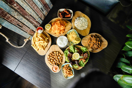 A table filled with a diverse assortment of delicious food items from different cuisines.