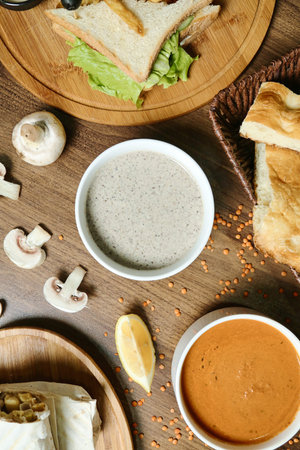 A table showcasing various plates of food and a bowl of soup.の写真素材