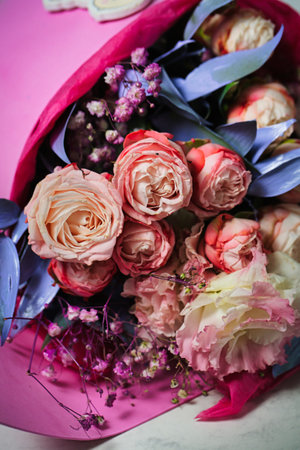A vibrant bouquet of flowers rests on a table, providing a lively centerpiece for any space.の写真素材