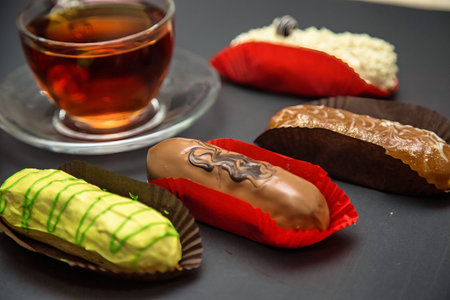 A table showcasing a variety of delicious desserts, including cakes, pastries, tarts, and cookies.
