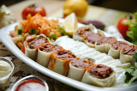 A joyful woman holding a refreshing cocktail in her hand, enjoying herself at a lively party.の写真素材
