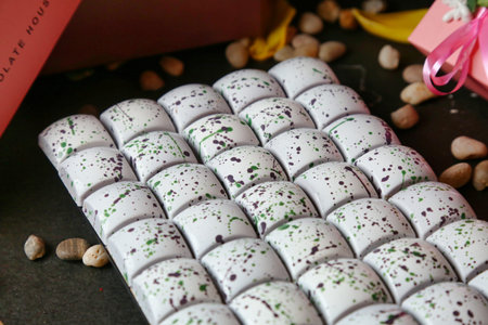A table covered with a generous selection of white chocolates in various shapes and sizes.