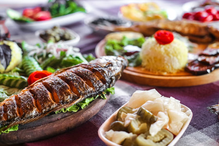 A close up view of a carefully arranged plate of appetizing food placed on a table.の写真素材