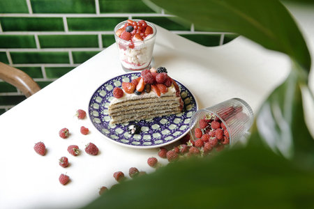 A delicious piece of cake is placed on a blue and white plate.の写真素材
