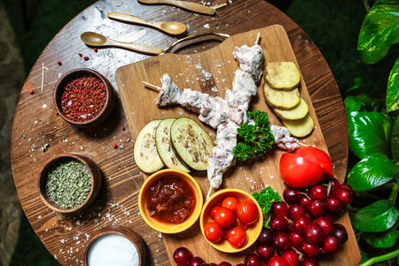 A wooden table is filled with a diverse assortment of delicious food items, offering a wide range of...