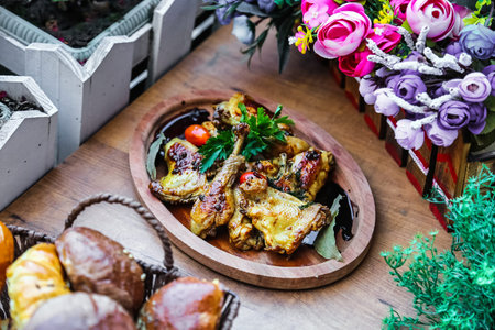 A plate of food is placed on a rustic wooden table, showcasing a delicious and enticing meal.