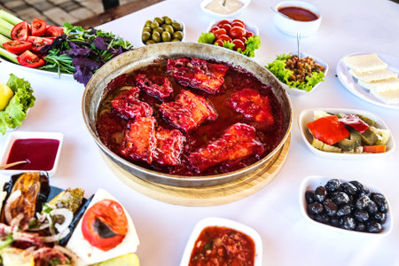A table with a variety of delicious food dishes placed on it, including a bowl of fresh and appetizing food.の写真素材