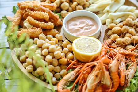 A platter featuring a variety of shrimp and other delectable dishes.