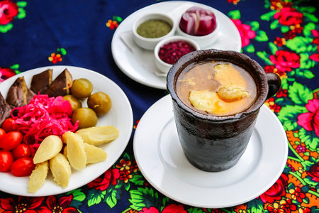 A table with two plates of food, showcasing a delicious meal.の写真素材