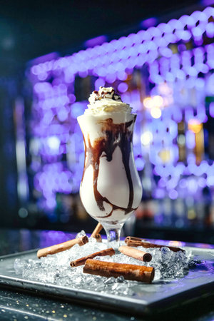 A decadent chocolate milkshake topped with creamy whipped cream and drizzled with rich chocolate...
