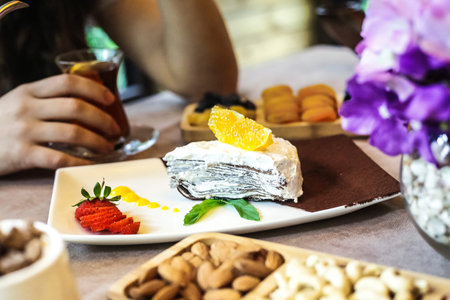 A table topped with various plates of food and desserts, arranged neatly for a delightful meal...