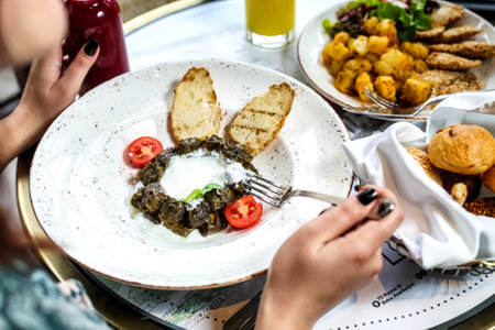 A table showcasing a multitude of mouth-watering dishes and a range of beverages.の写真素材