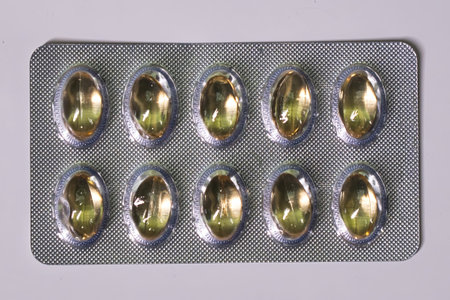 A full blister pack of yellow pills, likely vitamins or supplements.