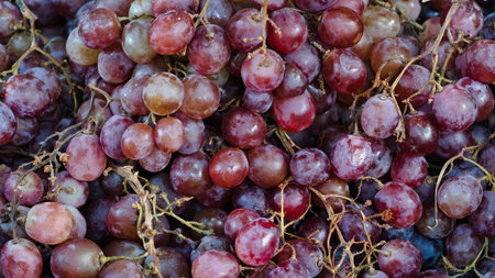 A close-up shot of a bunch of red grapes.