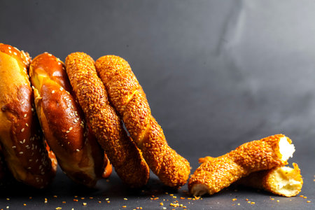 A tempting display of freshly baked pretzels showcases various styles, with a golden, crispy texture...