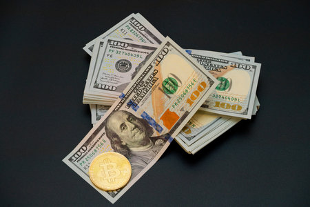Stacks of hundred-dollar bills alongside a prominent Bitcoin highlight the connection between...