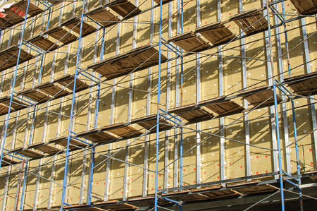 The wall being built homes equipped scaffoldingの写真素材