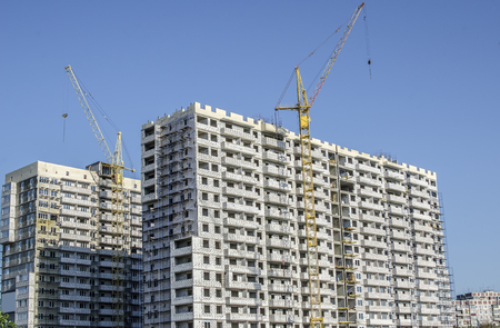 Under construction building of white brick arranged in a row.の写真素材