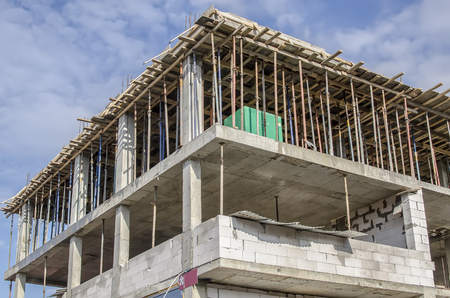 Close-up of two walls of a house under construction from white blocksの写真素材