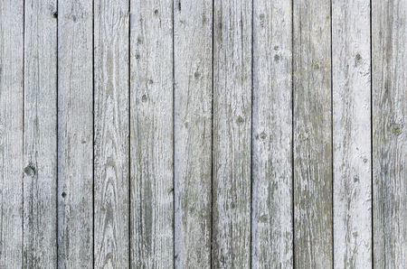 Gray background of vertical rough boards with knots.の写真素材