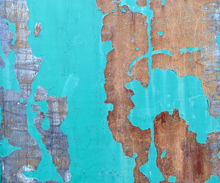 Texture of rusty metal with old green paint close up.の写真素材