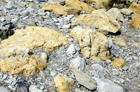 The accumulation of various stones on the seashoreの写真素材