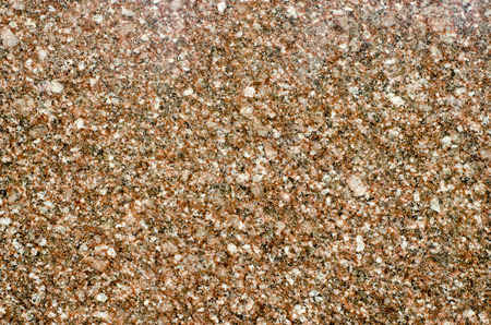 Background of ravnomernokristallichesky structure of brown granite close up.の写真素材