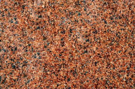 Background of brown-black granite with granular structureの写真素材