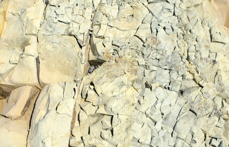 Background of patterned texture of gray fractured stone close-upの写真素材