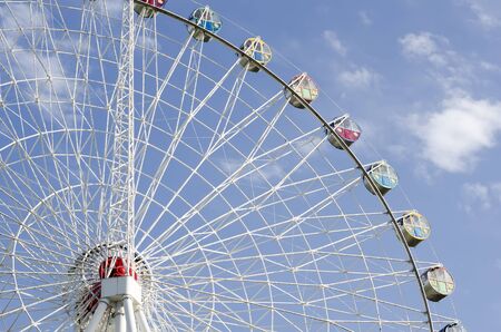 Openwork attraction design with booths against the skyの写真素材