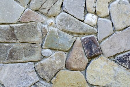 Close-up of a clastic structure of densely laid large pebbles of sandstone.の写真素材