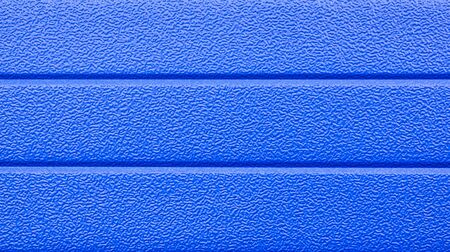 Three stripes of horizontal background texture with a rough surface in blue closeup.の写真素材