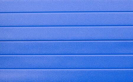 Horizontal background texture with a rough surface in blue closeup.の写真素材