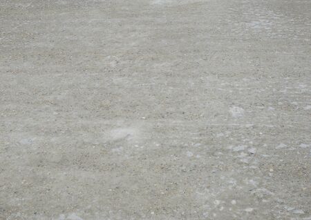 Homogeneous gray background with bright spots and rounded gray blotches.の写真素材