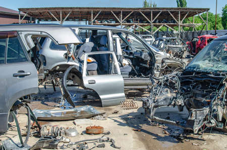 Disassembled cars of different conditions in the open air, close-up.の写真素材