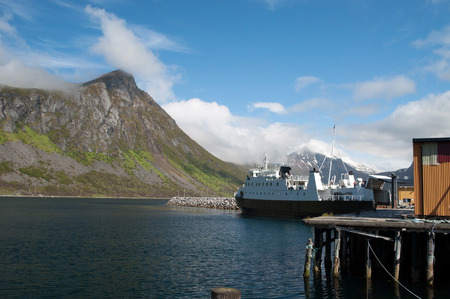 Gryllefjord is a fishing village and also the administrative centre of Torsken municipality, on the island of Senja, in Troms county, Norway. It is located along the Gryllefjorden in the northern part of the municipality. View to mountain Jesla.の写真素材