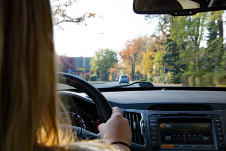 Young Girl is driving a car.の写真素材