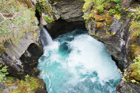 Gudbrandsjuvet is a 5 metre narrow and approx. 25 metre high ravine through which the Valldoela River forces itself. の写真素材