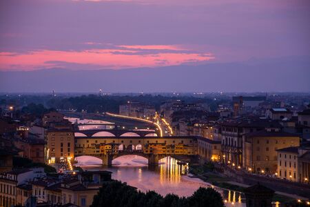 The Ponte Vecchio is a medieval stone closed-spandrel segmental arch bridge over the Arno River, in Florence, Italyの写真素材