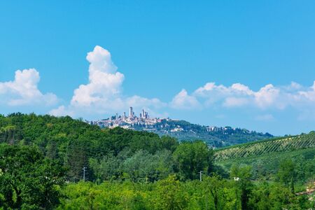 San Gimignano is a small walled medieval hill town in the province of Siena, Tuscany, Italy. Known as the Town of Fine Towers, San Gimignano is famous for its medieval architecture,の写真素材