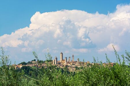 San Gimignano is a small walled medieval hill town in the province of Siena, Tuscany, Italy. Known as the Town of Fine Towers, San Gimignano is famous for its medieval architecture,の写真素材