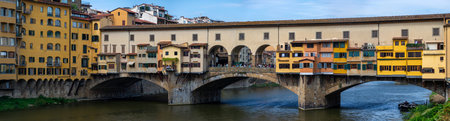 The Ponte Vecchio is a medieval stone closed-spandrel segmental arch bridge over the Arno River, in Florence, Italyの写真素材