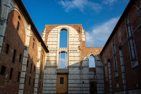 Siena Cathedral is a medieval church in Siena, Italy, dedicated from its earliest days as a Roman Catholic Marian church, and now dedicated to the Assumption of Mary. の写真素材