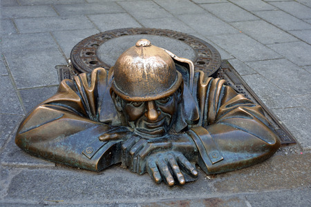 Cumil statue in the Laurinsky street of the Slovak capital Bratislava - Slovakia.の写真素材