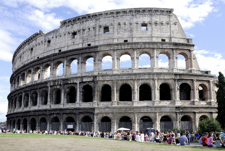 Tourists in front of the Colosseum at the Piazza del Colosseo in Rome - Italy.のeditorial素材