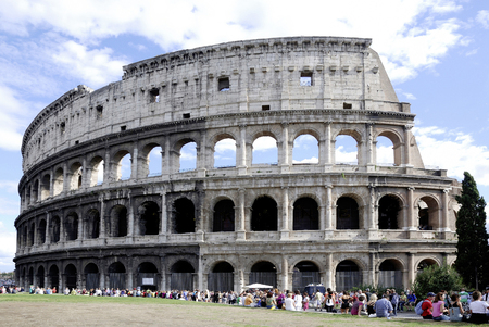 Tourists in front of the Colosseum at the Piazza del Colosseo in Rome - Italy.のeditorial素材