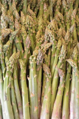 Green asparagus on the fruit and vegetable market Naschmarkt in Vienna - Austria.の写真素材