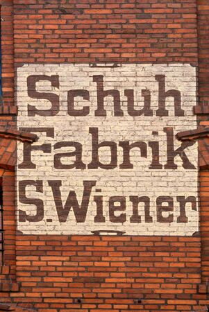 Building in Torun with old lettering in german language - Poland.の写真素材